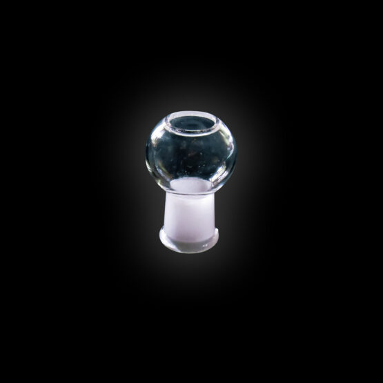 A glass ball is sitting on top of a white base.