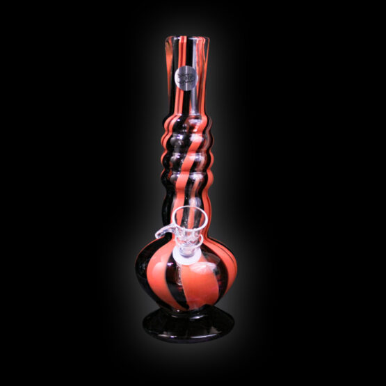 A black and red glass pipe sitting on top of a table.