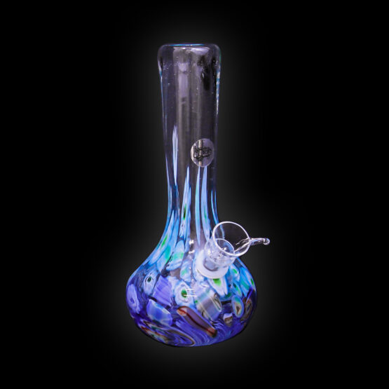 A glass vase with blue and white liquid inside of it.