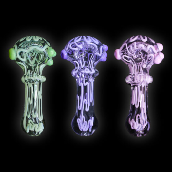 A group of three glass pipes that are lit up.
