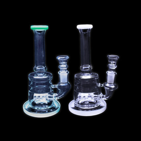 A couple of glass pipes sitting on top of a table.