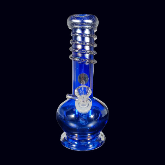 A blue glass pipe sitting on top of a table.